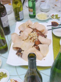 Roast chicken garnished with prawn crackers